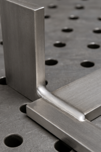 Finished silver solder joint on metal components showing clean, uniform bonding